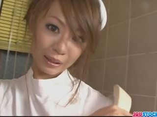 Erotic Asian nurse in tight white pantyhose playing with her w
