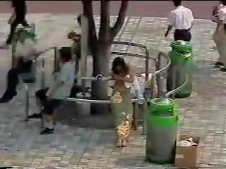 Changing in the street - Japanese girl in public first part
