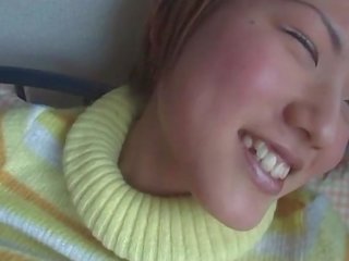 Little jap schoolgirl squeezing her tits while getting cunt finger fucked