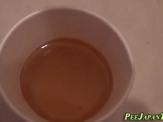 Asian ho pees into cup
